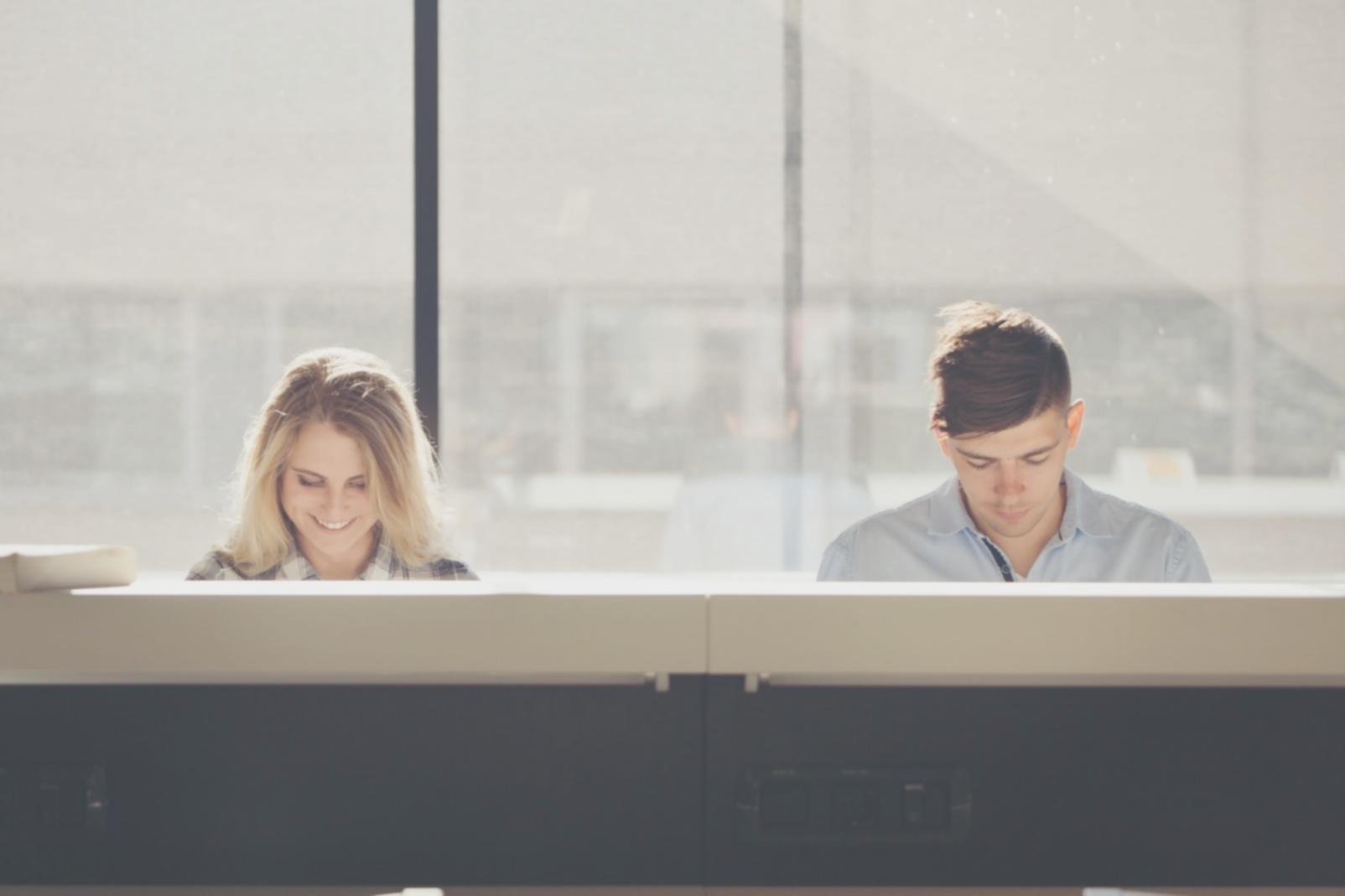 Person reviewing budget documents and financial planning materials
